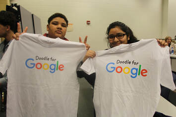 Kaden Merritte and Vanessa Carillo-Ramos show off their Google shirts after hearing the presentation by Google designer Ryan Germick.